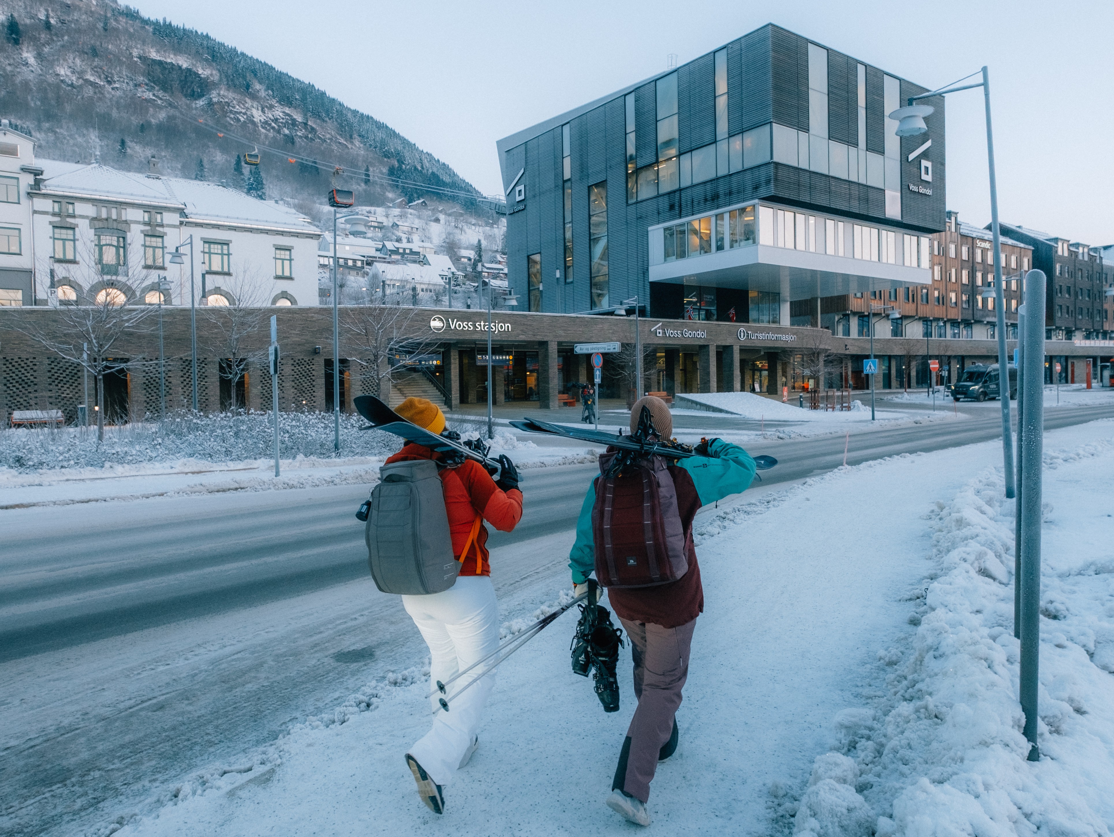 two skiers on their way to voss station and the touristinformation